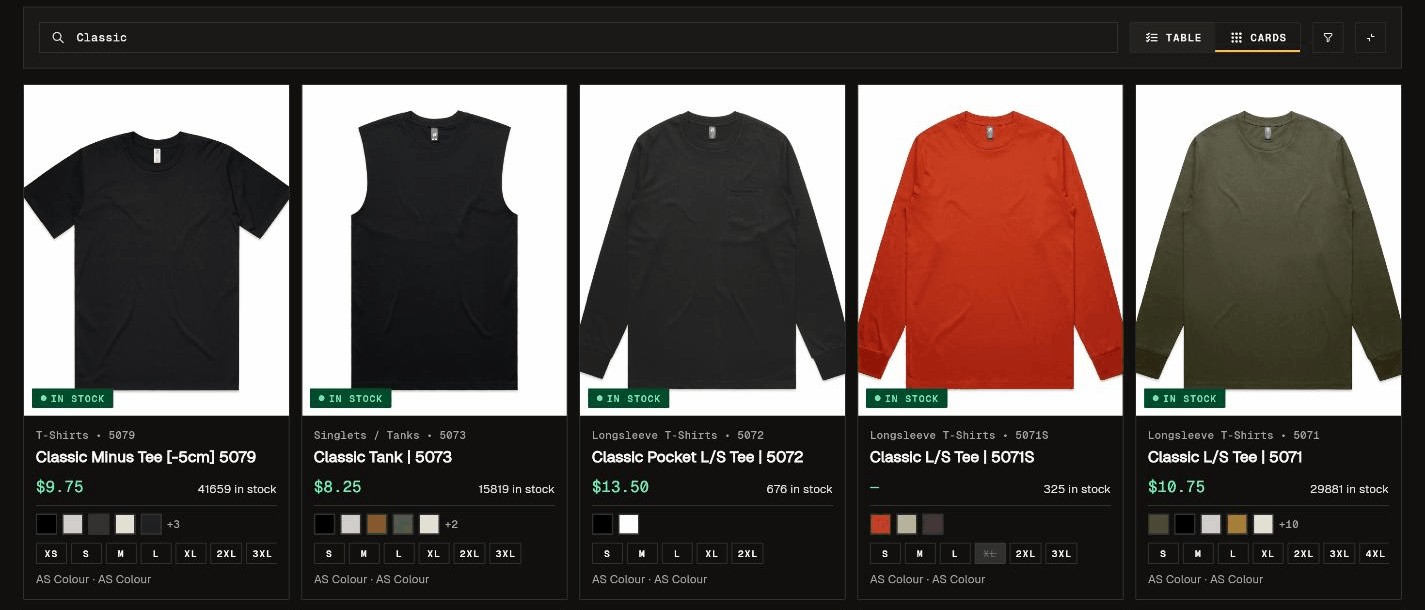 The garment catalogue in PRINTOOLS CRM in card view: five AS Colour Classic tees with price, stock on hand, colours and sizes